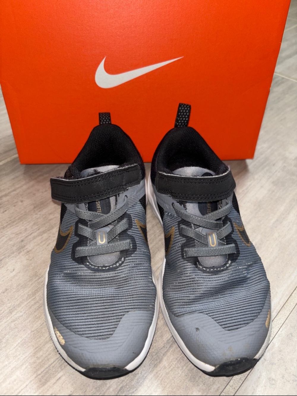 Nike Kids Gray and Black Slip-On Sneakers with Gold Swoosh